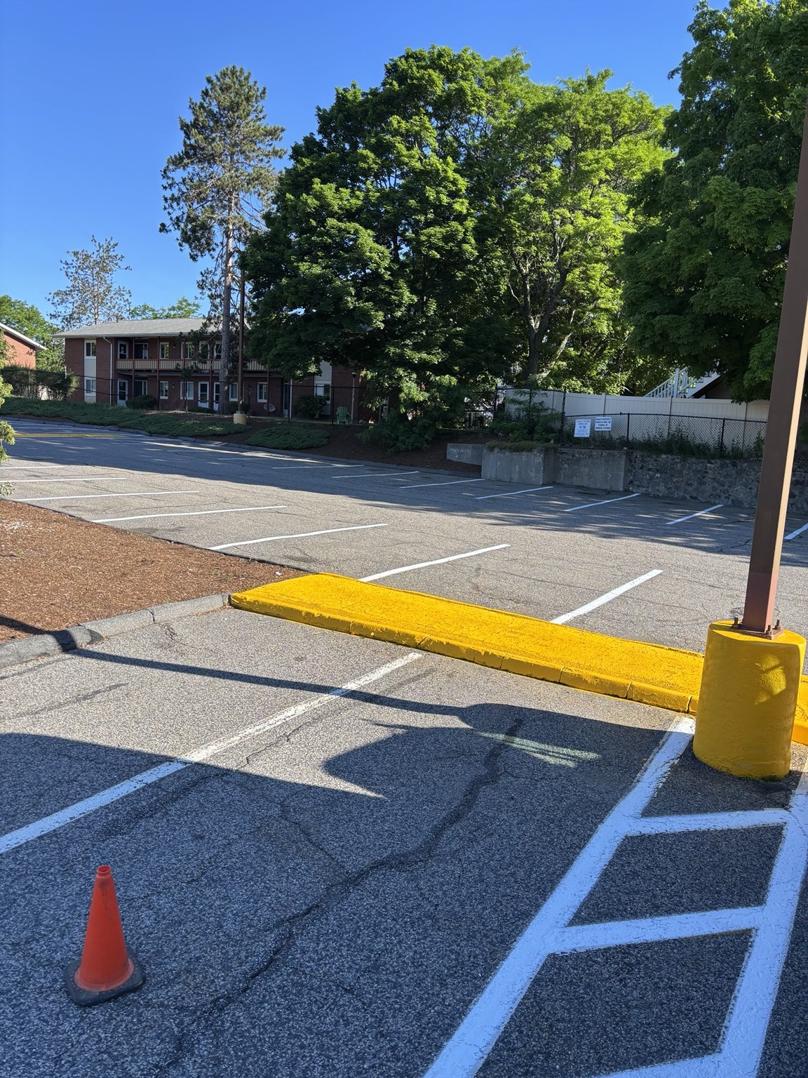 Yellow curb and white access aisle striping